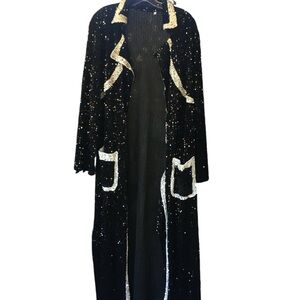Ladies long black sequin coat/jacket with white trim